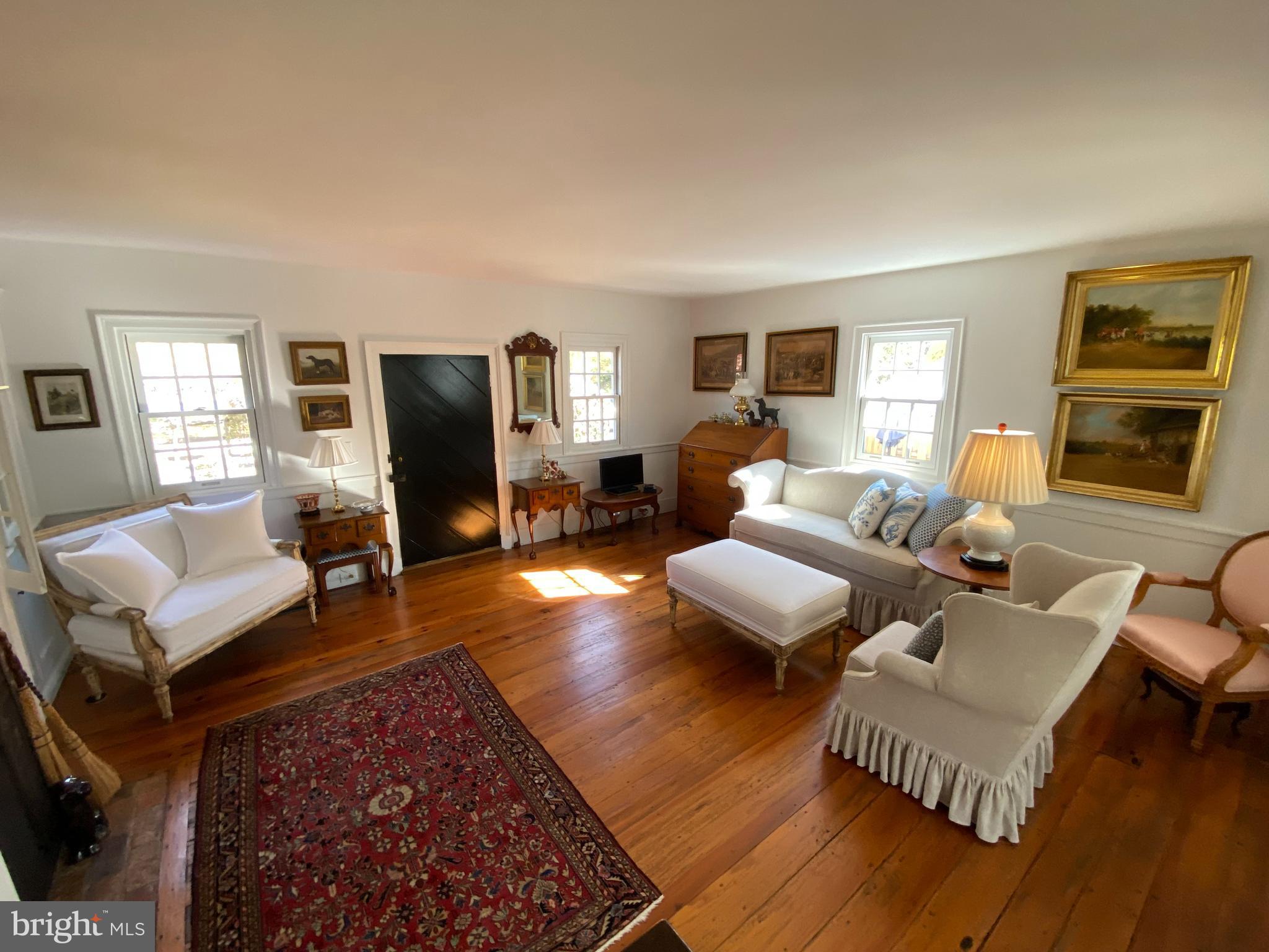 10230 John Carvill Road Chestertown, MD 21620 - Photo 16 of 41 a living room with furniture wooden floor and a window