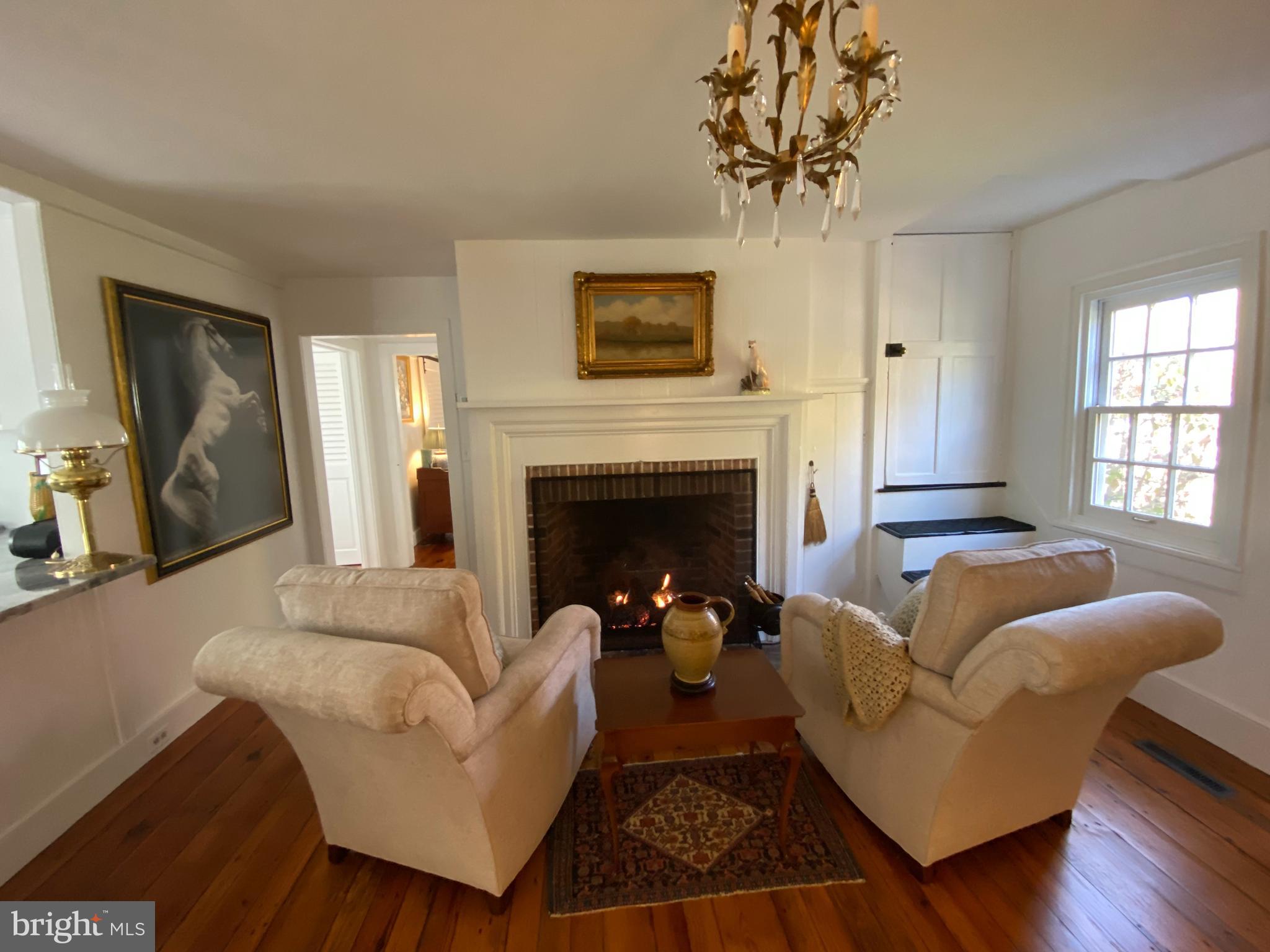 10230 John Carvill Road Chestertown, MD 21620 - Photo 20 of 41 a living room with furniture and a fireplace