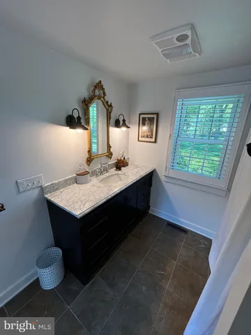 a kitchen with a sink cabinets and a stove