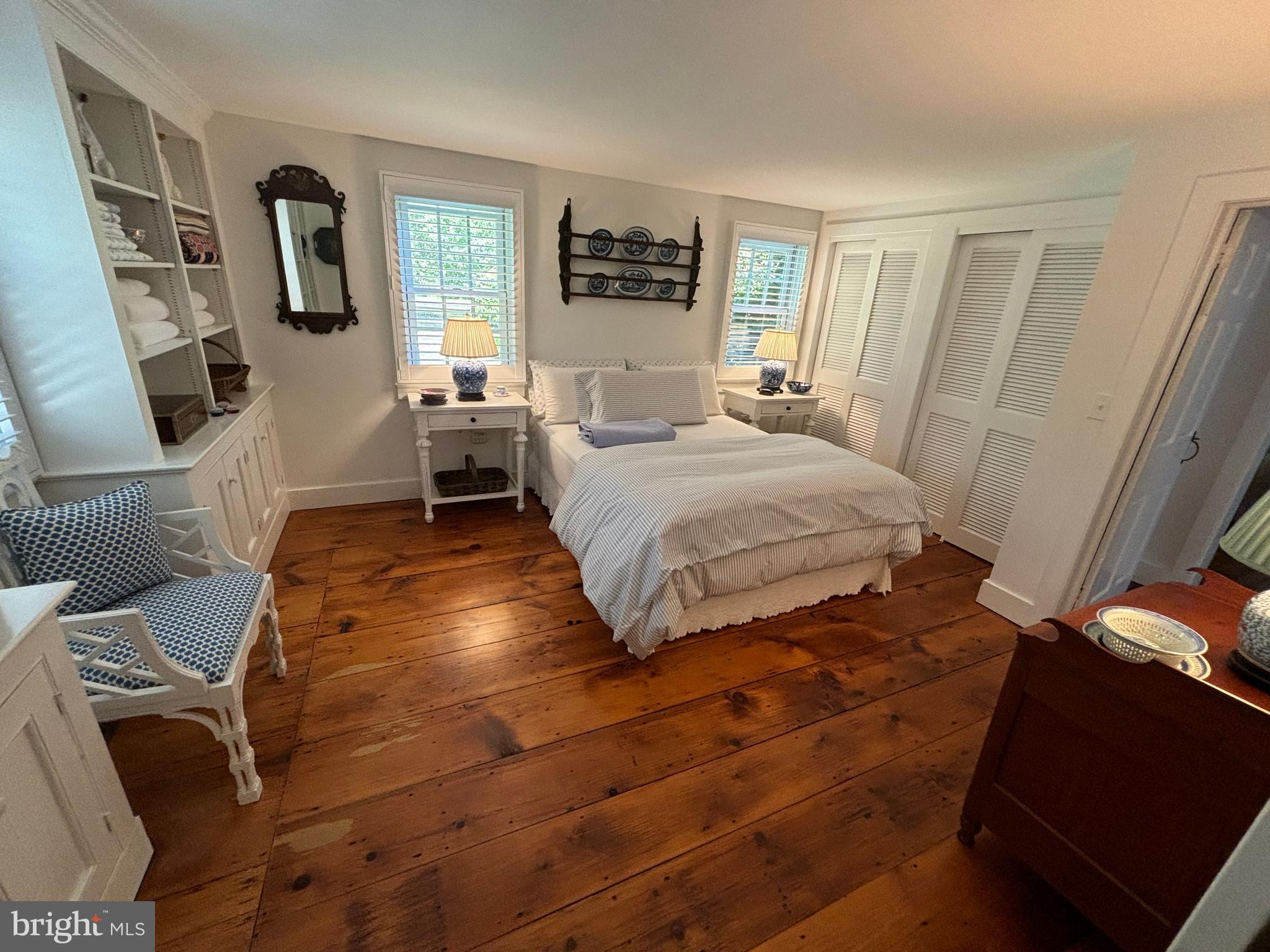10230 John Carvill Road Chestertown, MD 21620 - Photo 28 of 41 a bedroom with a bed and wooden floor