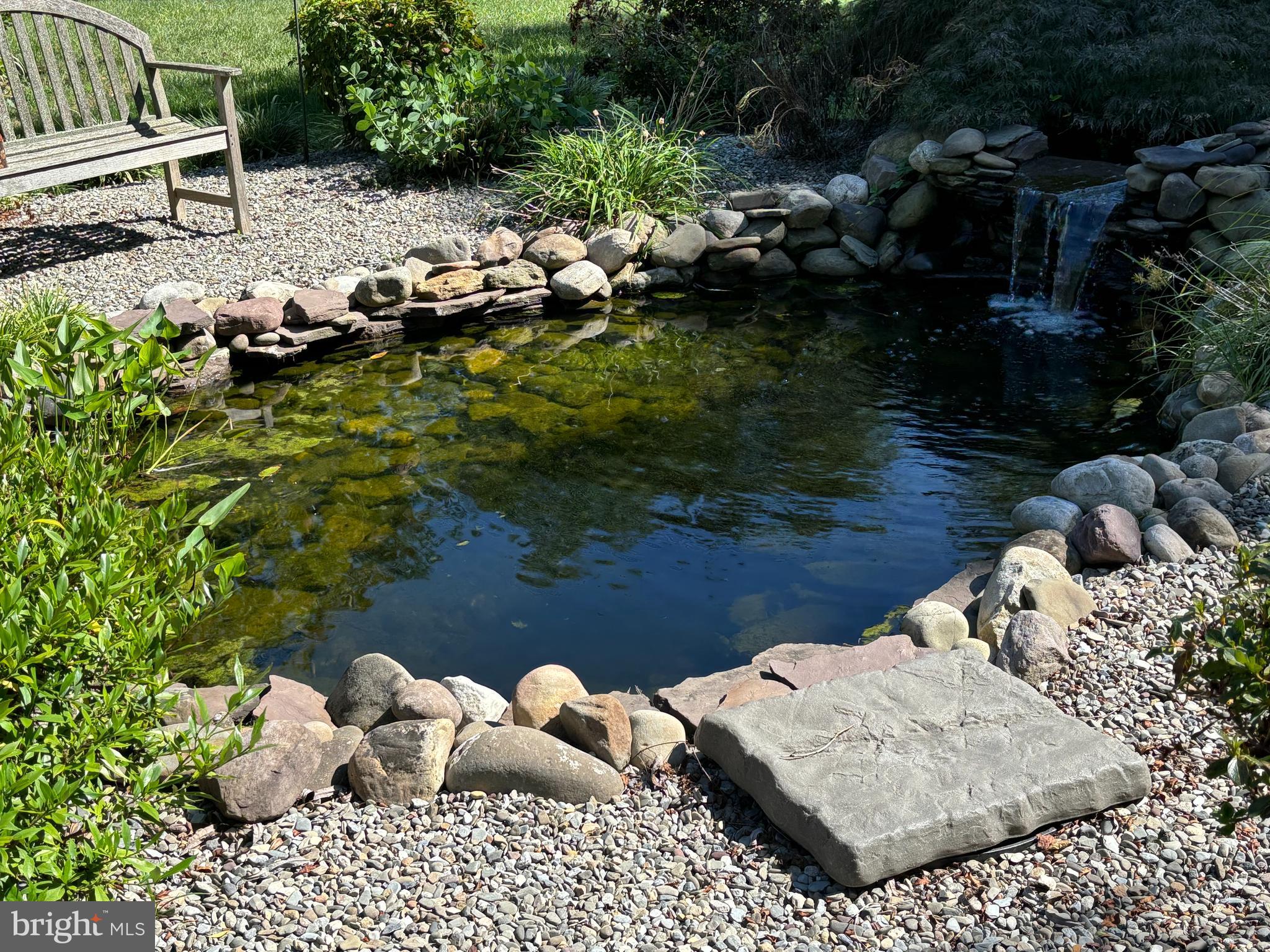 10230 John Carvill Road Chestertown, MD 21620 - Photo 34 of 41 a view of a house with a yard and a pond