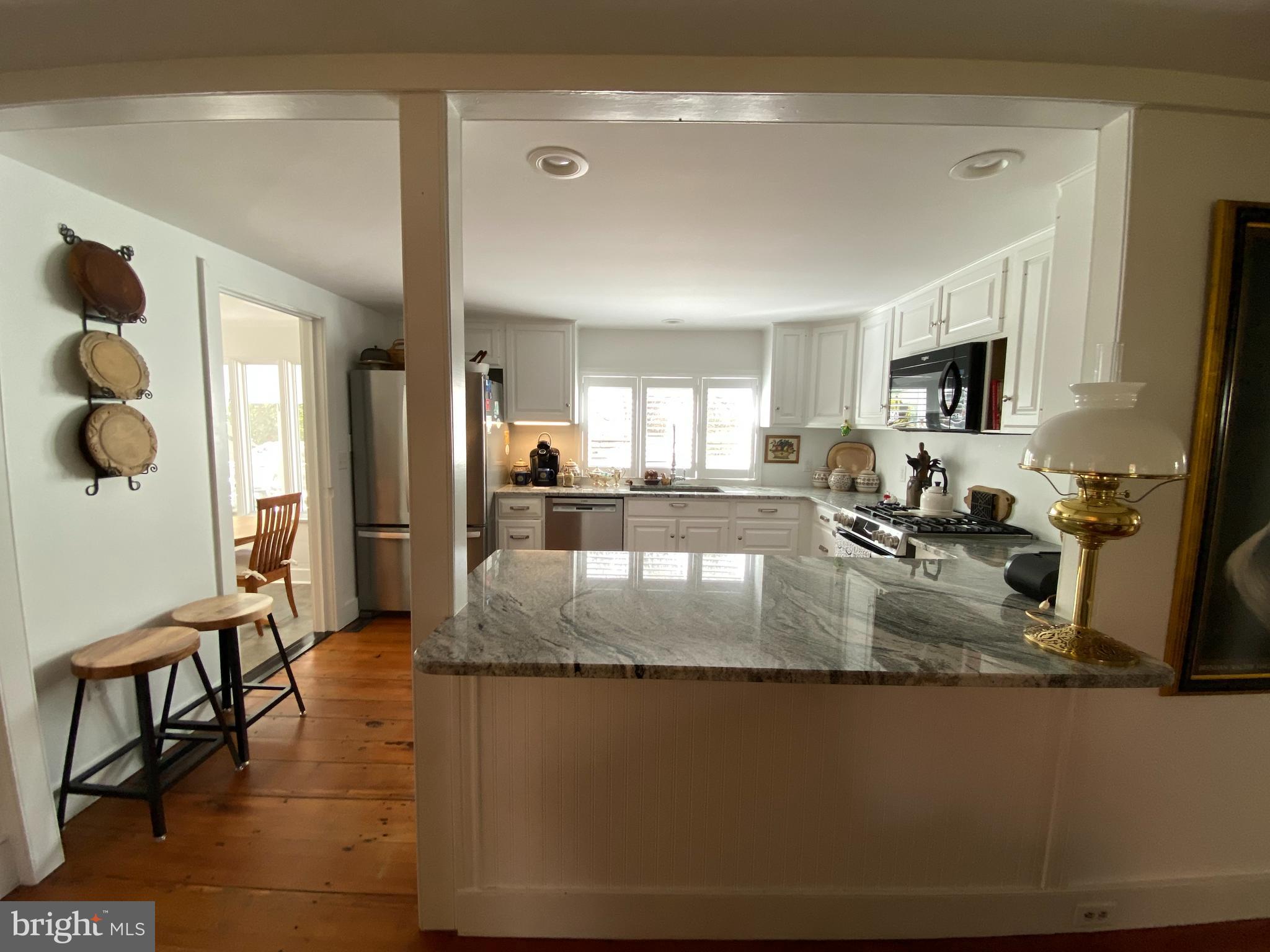 10230 John Carvill Road Chestertown, MD 21620 - Photo 6 of 41 a view of a kitchen counter top space with stainless steel appliances granite countertop a stove and a sink