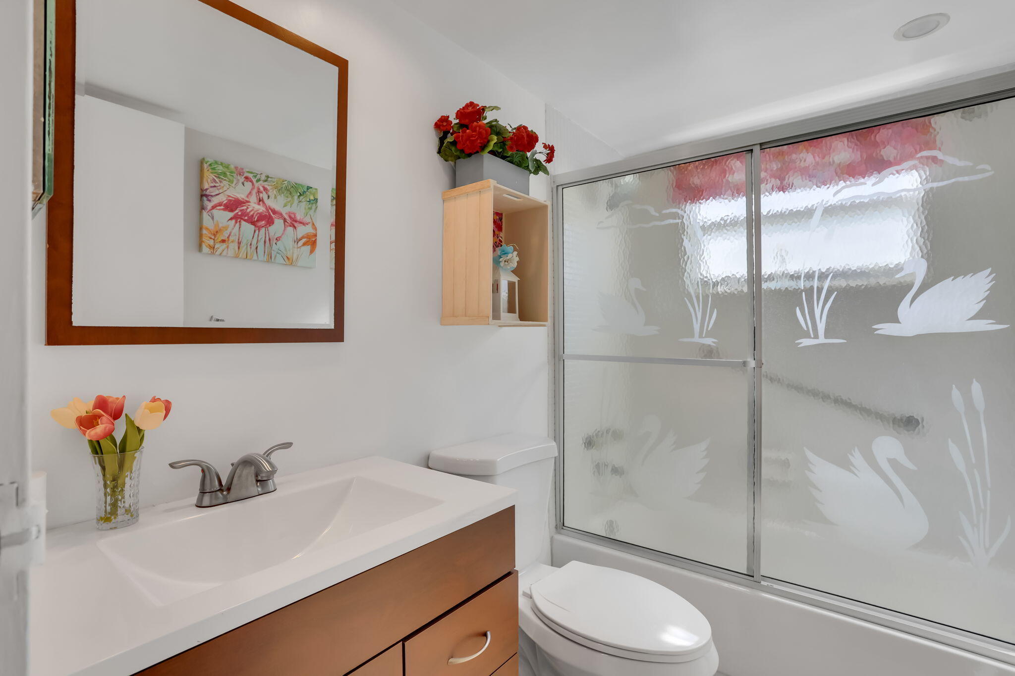 152 Tuscany Lane, Unit C Delray Beach, FL 33446 - Photo 20 of 40 a bathroom with a sink vanity mirror and toilet