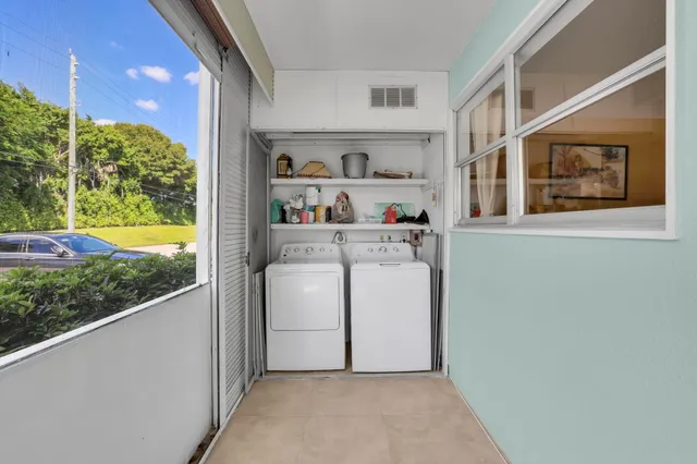 a view of a kitchen with a large window