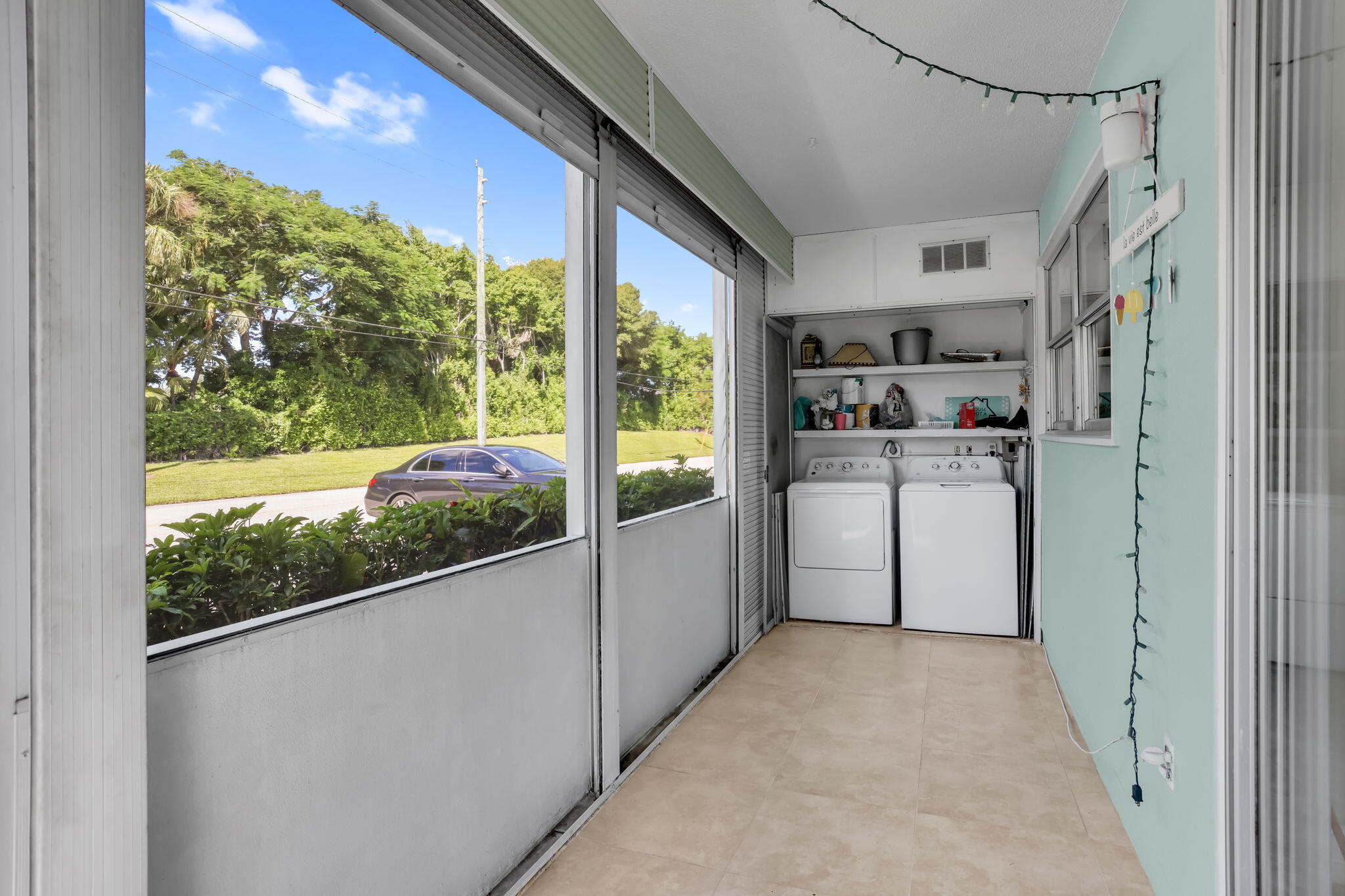 152 Tuscany Lane, Unit C Delray Beach, FL 33446 - Photo 22 of 40 a view of a kitchen with a large window