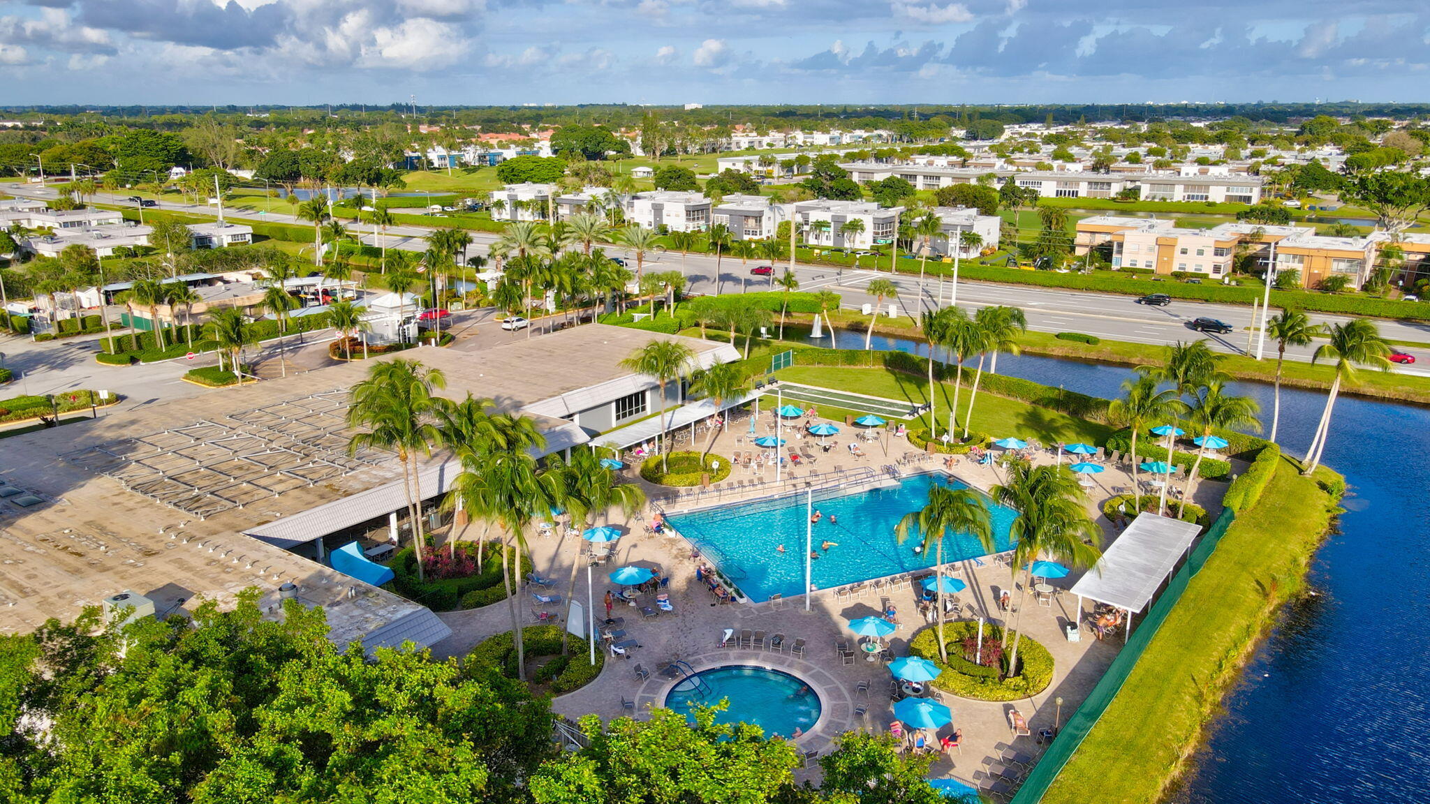 152 Tuscany Lane, Unit C Delray Beach, FL 33446 - Photo 28 of 40 an aerial view of residential houses with outdoor space and swimming pool
