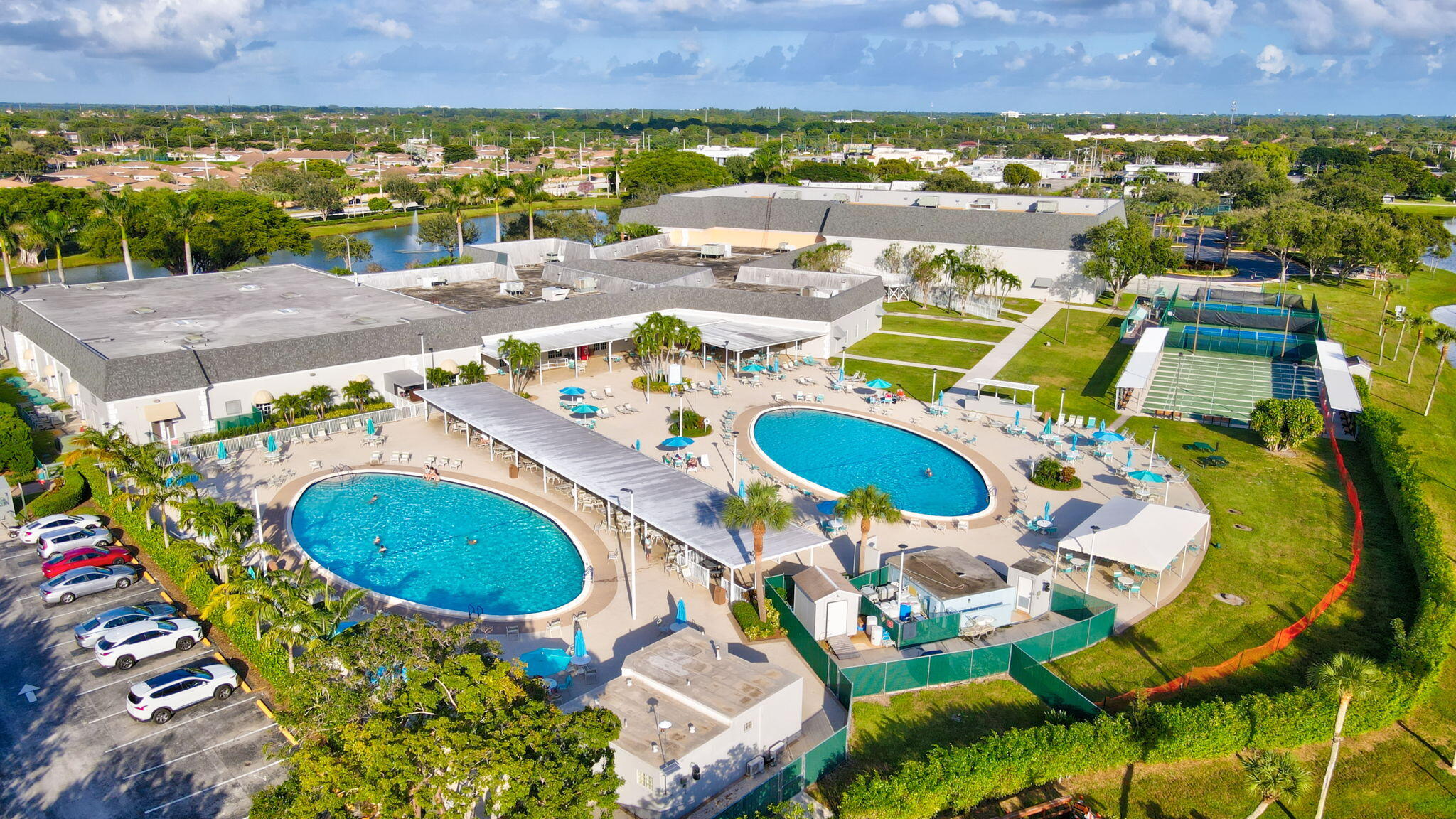 152 Tuscany Lane, Unit C Delray Beach, FL 33446 - Photo 29 of 40 an aerial view of a house with a swimming pool yard and outdoor seating