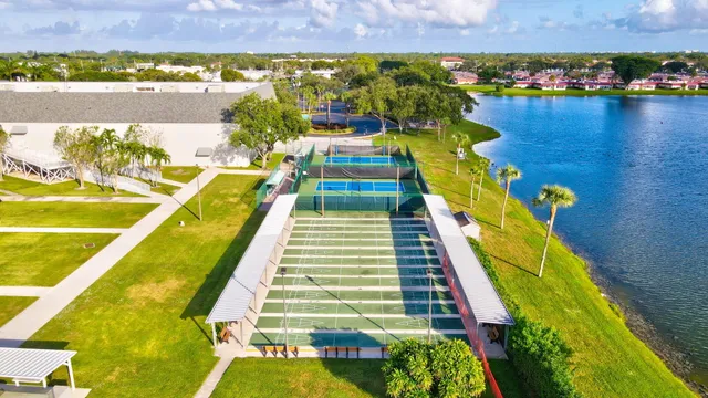 an aerial view of a residential houses with outdoor space