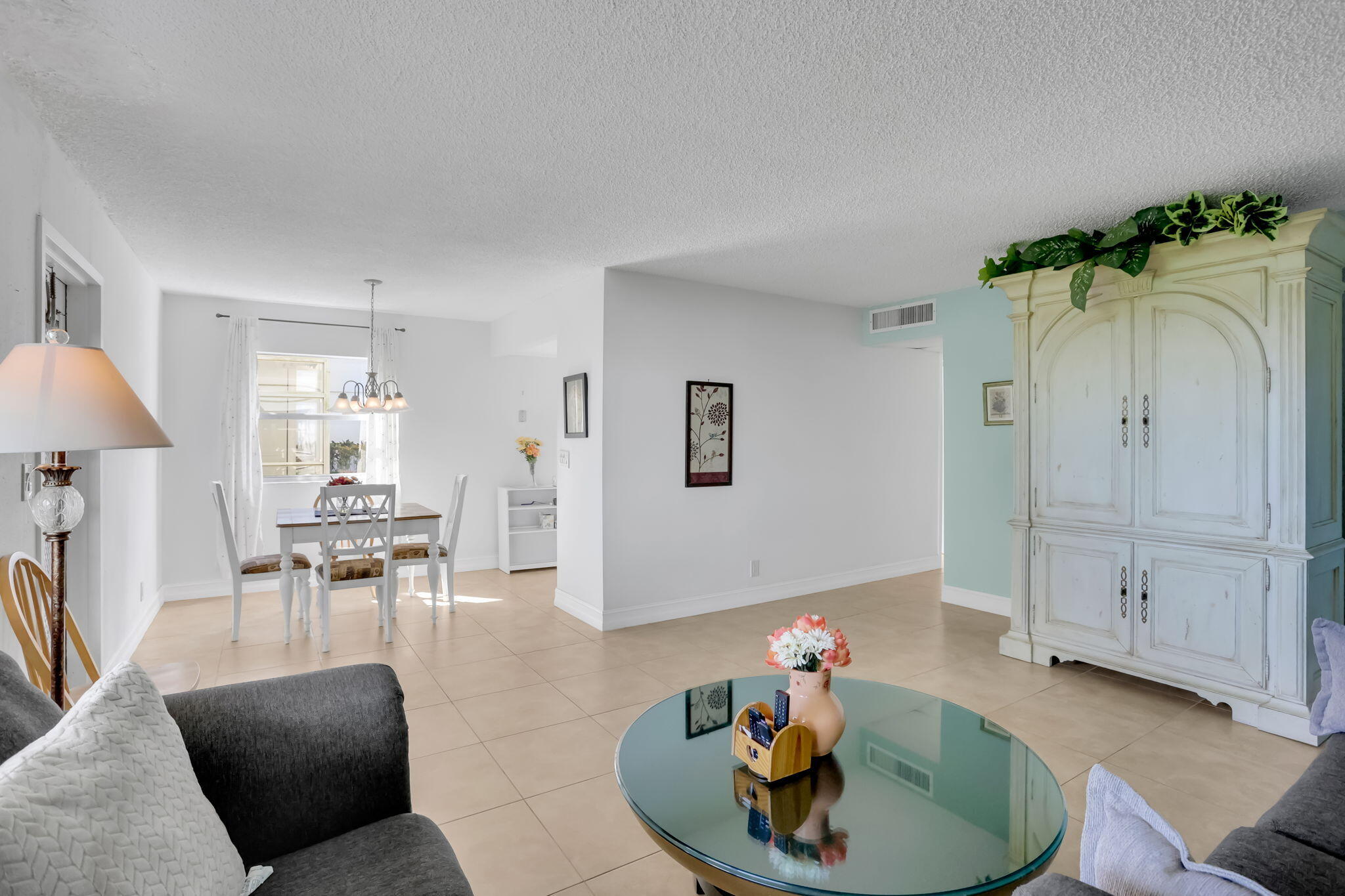 152 Tuscany Lane, Unit C Delray Beach, FL 33446 - Photo 7 of 40 a living room with furniture and a wooden floor