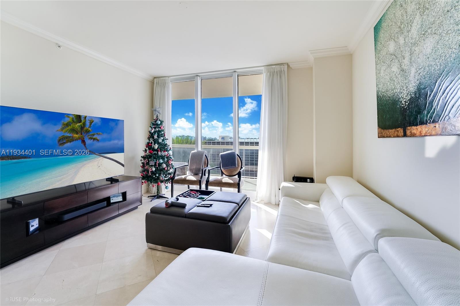9559 Collins Avenue, Unit S5F Surfside, FL 33154 - Photo 3 of 27 a living room with furniture and a floor to ceiling window