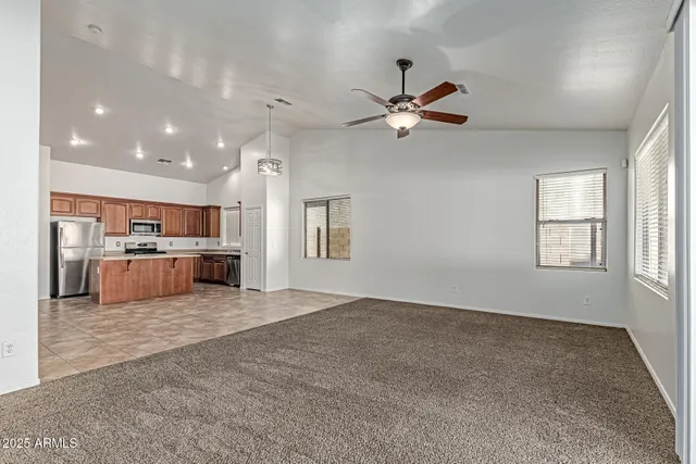 a view of a kitchen with a sink and a window
