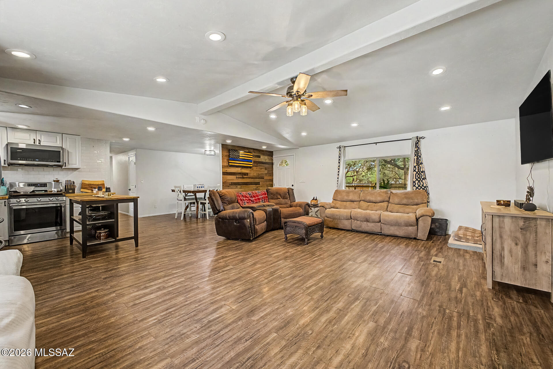 4231 East Pinal Street Tucson, AZ 85739 - Photo 7 of 36 a living room with furniture and a wooden floor