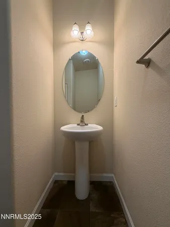 a bathroom with a sink and mirror