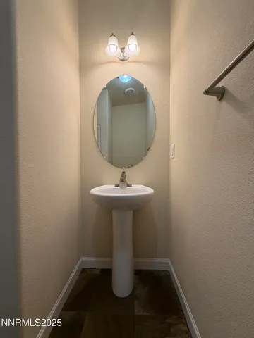 a bathroom with a sink and mirror
