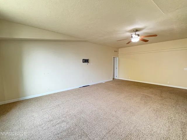 a view of a big room with carpet