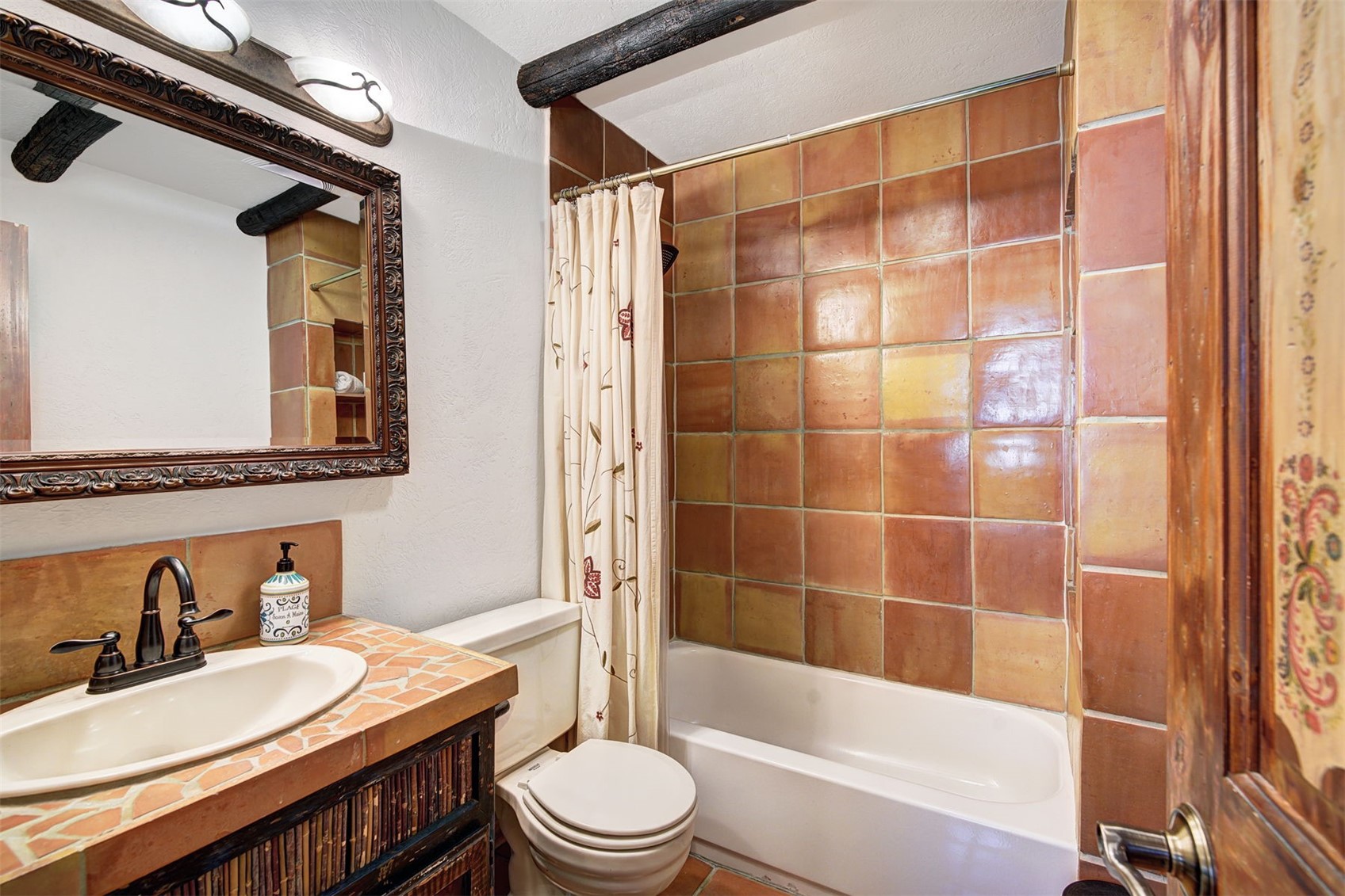 9460 Ryan Gulch Road, Unit 9460 Silverthorne, CO 80498 - Photo 25 of 39 a bathroom with a sink a toilet and shower
