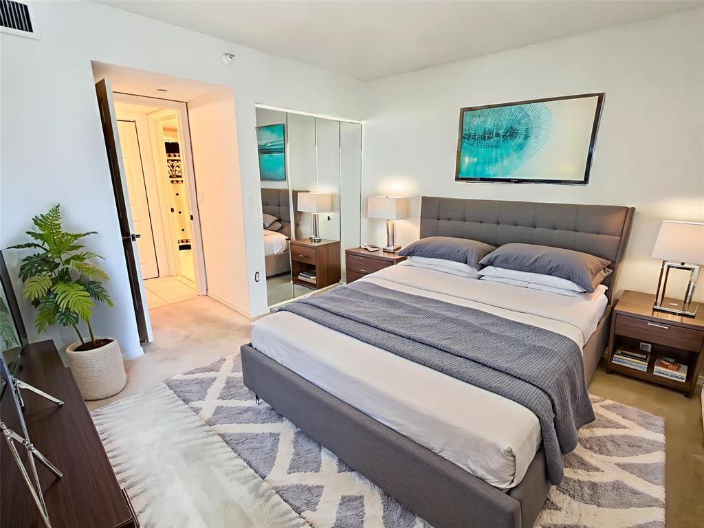 7763 Southampton Terrace, Unit 411 Tamarac, FL 33321 - Photo 12 of 33 a spacious bedroom with a bed and a couch