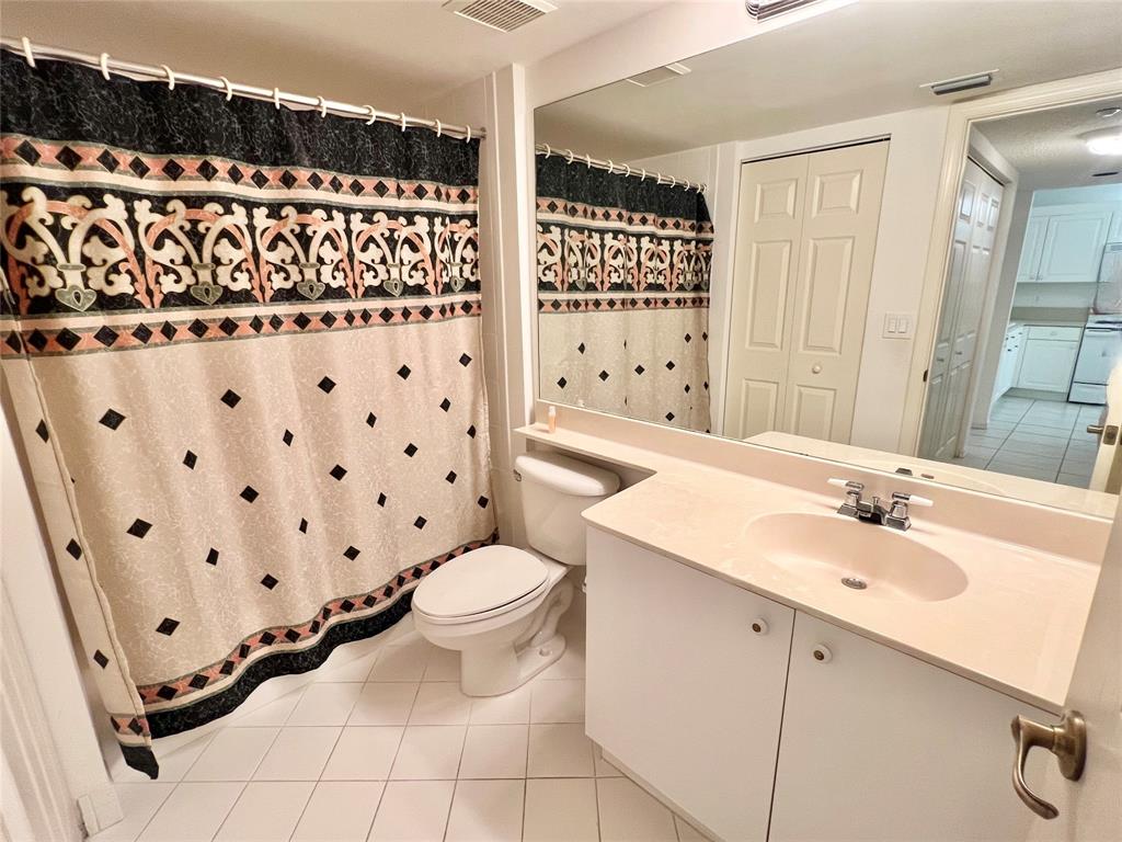 7763 Southampton Terrace, Unit 411 Tamarac, FL 33321 - Photo 14 of 33 a bathroom with a sink toilet and shower