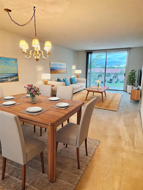 7763 Southampton Terrace, Unit 411 Tamarac, FL 33321 - Photo 7 of 33 a view of a dining room and a chandelier