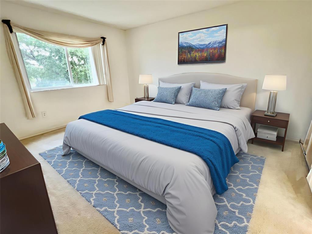 7763 Southampton Terrace, Unit 411 Tamarac, FL 33321 - Photo 8 of 33 a bedroom with a bed and a painting on the wall