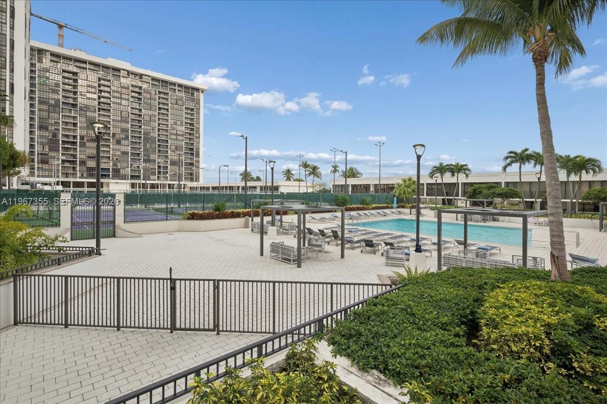 1915 Brickell Avenue, Unit 801 Miami, FL 33129 - Photo 29 of 37 a view of a swimming pool with a terrace