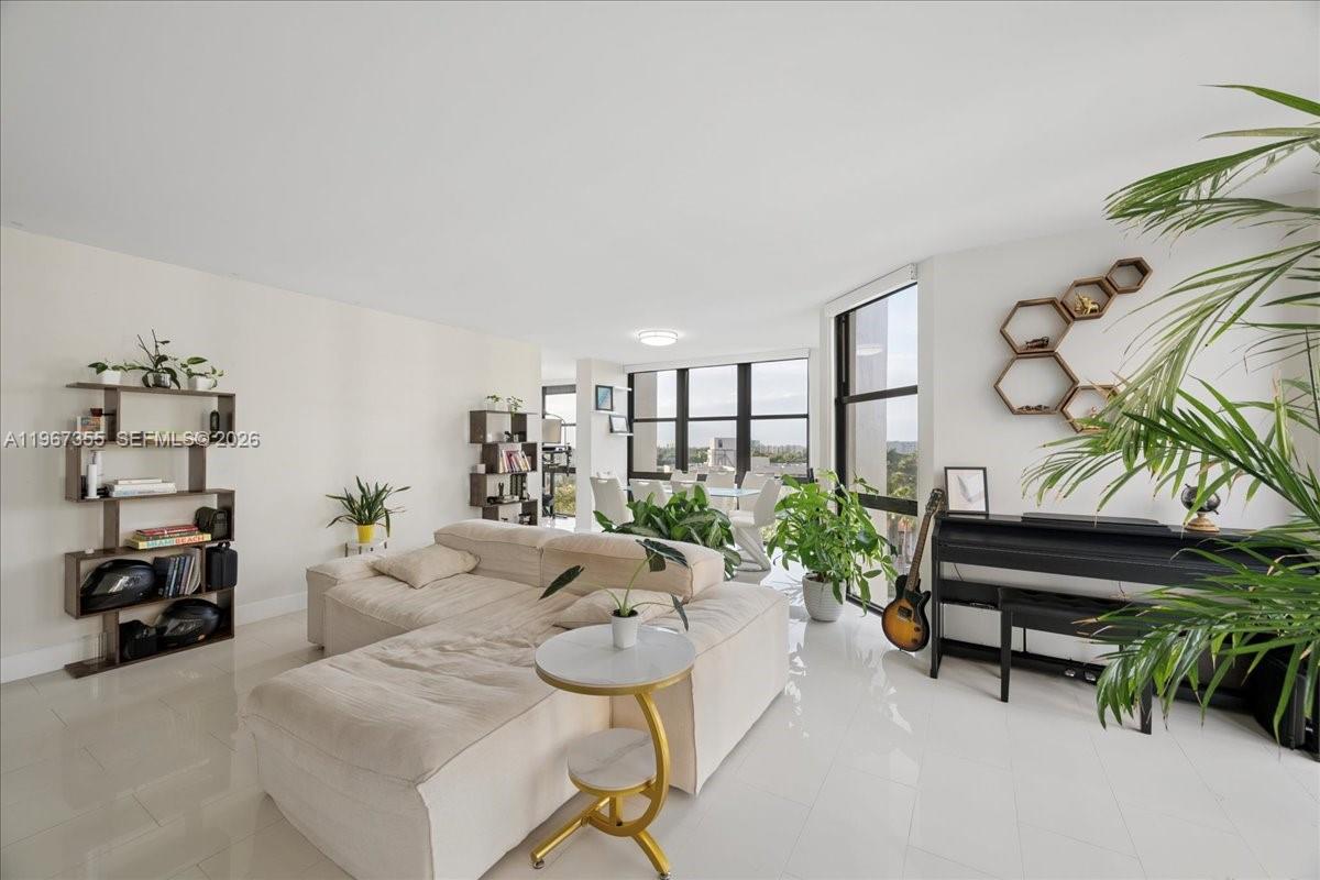 1915 Brickell Avenue, Unit 801 Miami, FL 33129 - Photo 7 of 37 a living room with furniture and wooden floor