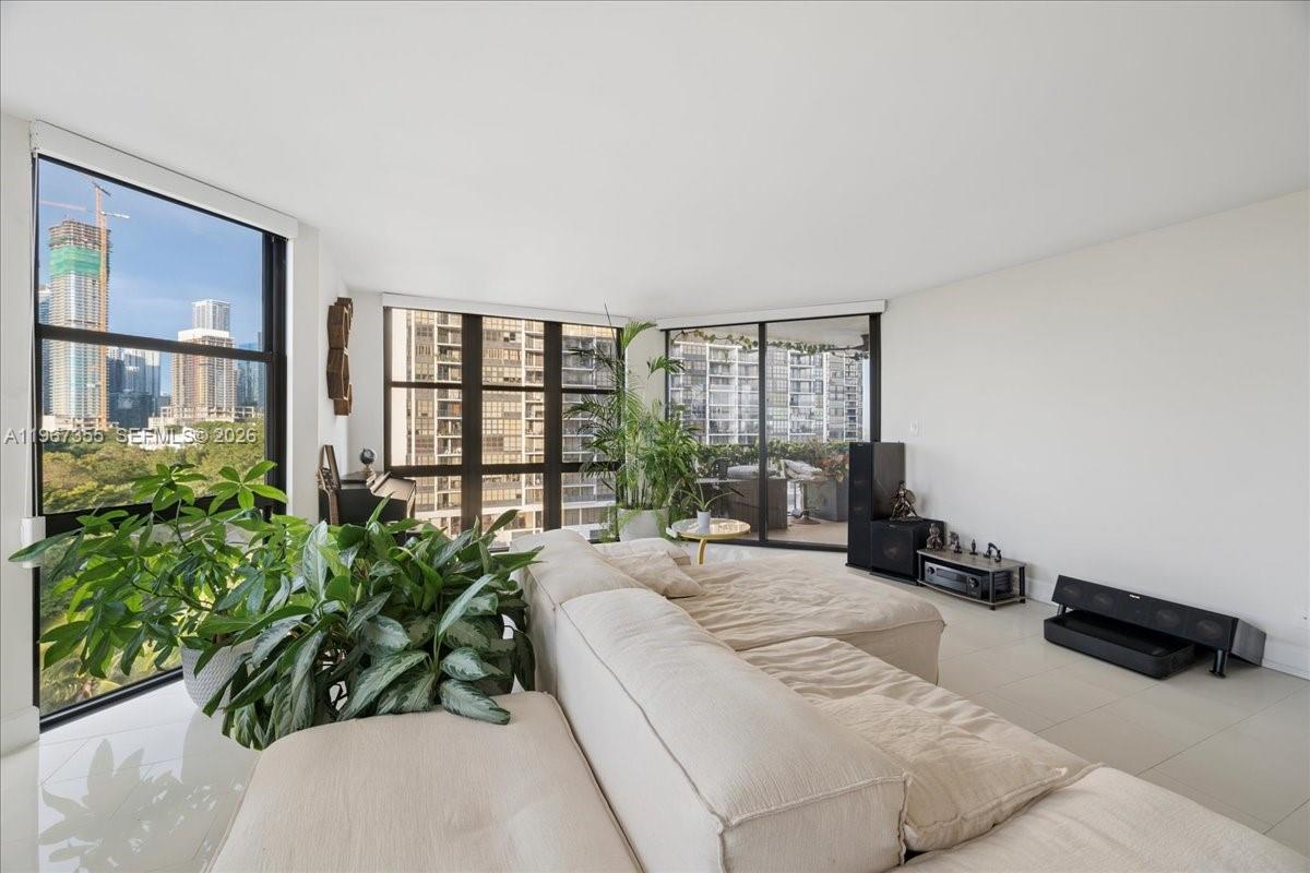 1915 Brickell Avenue, Unit 801 Miami, FL 33129 - Photo 8 of 37 a large bedroom with a bed and large window