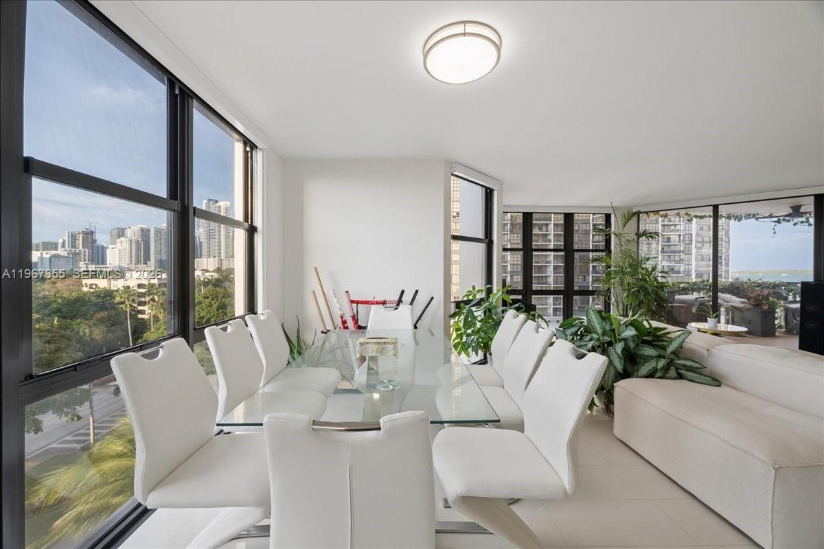 1915 Brickell Avenue, Unit 801 Miami, FL 33129 - Photo 9 of 37 a living room with furniture and a large window