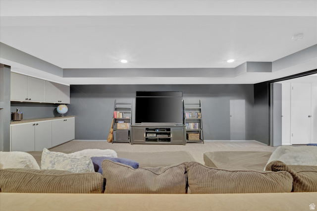 510 Spring Creek Road Providence, UT 84332 - Photo 34 of 97 Spacious room featuring recessed lighting, a built-in media center, floor-to-ceiling shelving, and integrated cabinetry with a countertop