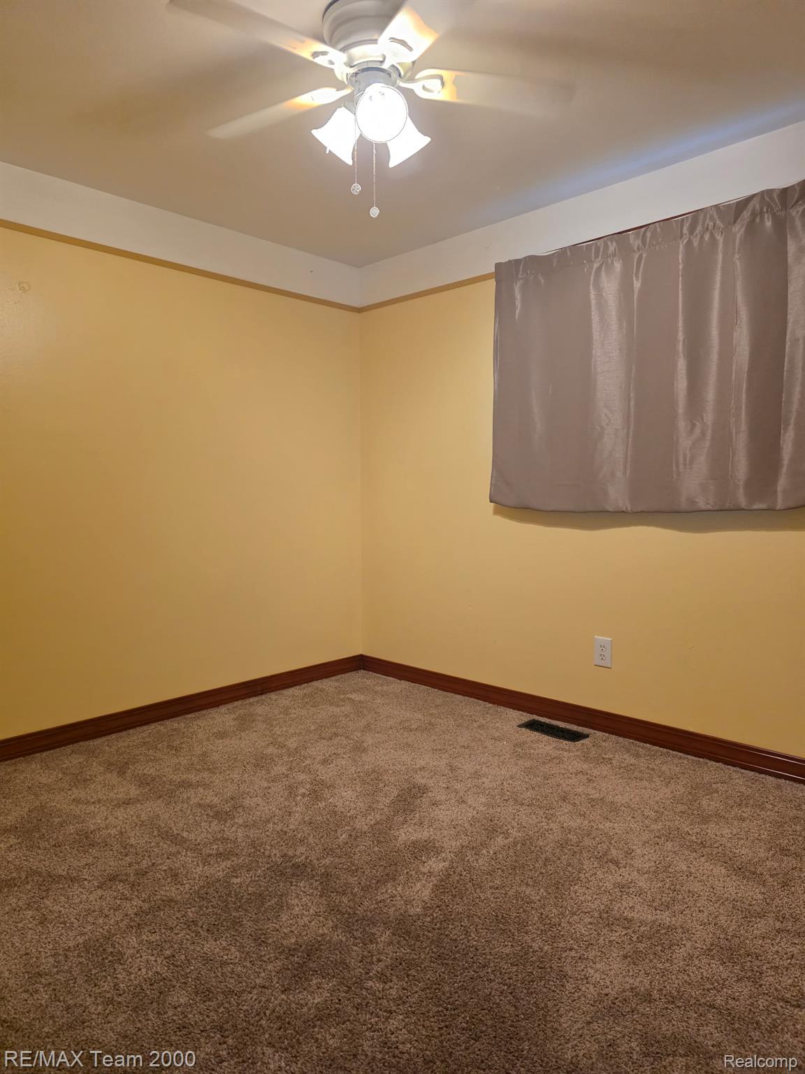 38114 Walnut Street Romulus, MI 48174 - Photo 10 of 18 Bedroom featuring neutral-toned carpet flooring, yellow painted walls, and white crown molding