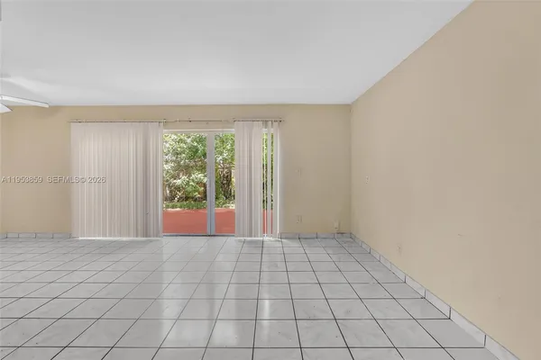 a view of an empty room and window