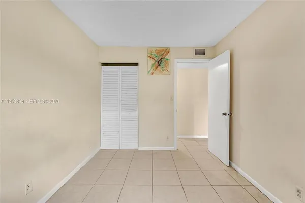 a bathroom with a sink toilet and a mirror