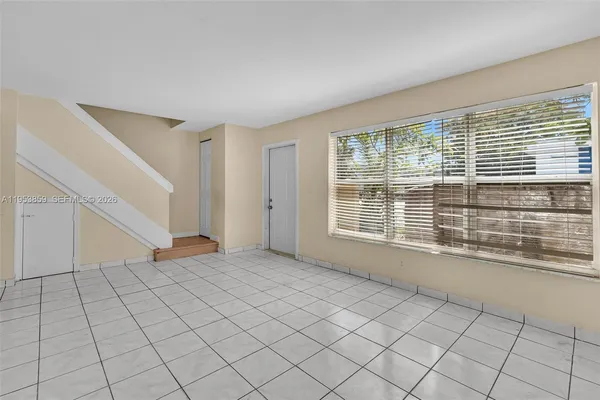 a view of an empty room with a window