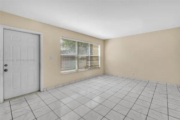 a view of an empty room and window