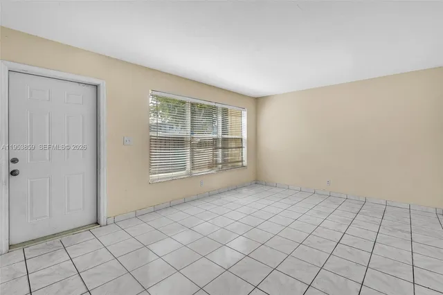 a view of an empty room and window