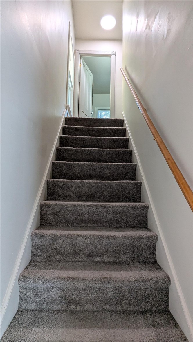 435 Main Street Oneonta, NY 13820 - Photo 14 of 38 Staircase leads to full bath and 3 bedrooms on 2nd