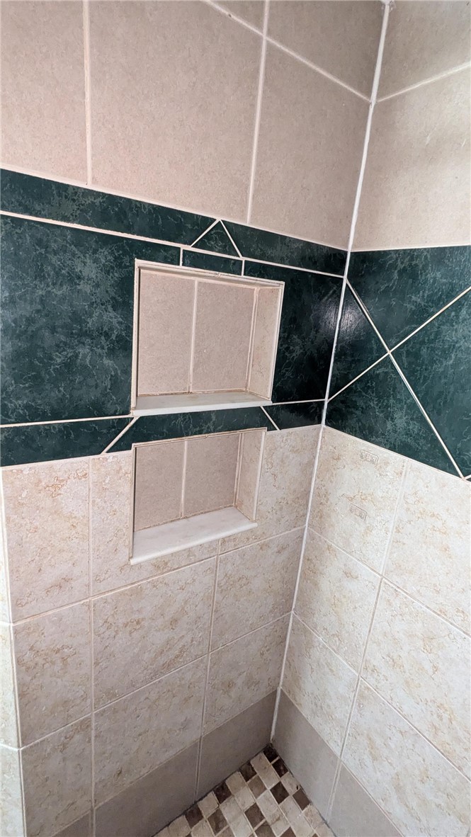 435 Main Street Oneonta, NY 13820 - Photo 24 of 38 Cubby for shampoo, etc