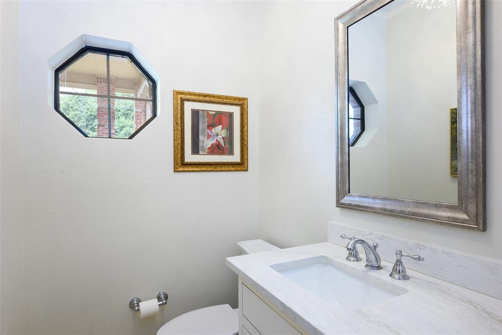 6822 Meadow Road Dallas, TX 75230 - Photo 23 of 35 Hall Half Bath. Travertine floors. Updated lighting.