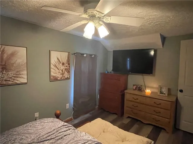 a view of a workspace with furniture and a flat screen tv