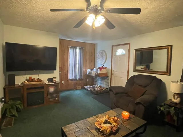a view of a dining room with furniture and a mirror