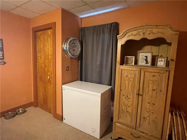 a kitchen with granite countertop wood cabinets and white appliances