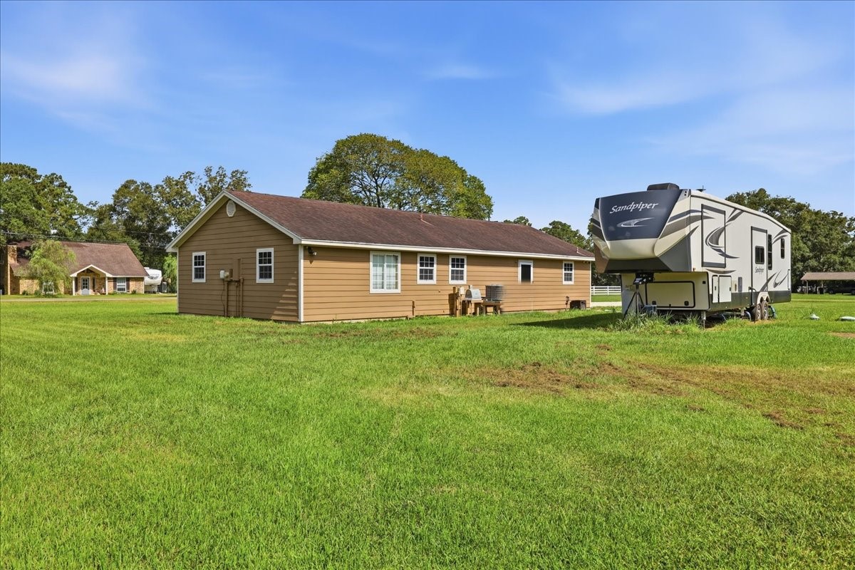 14183 Craigen Road Beaumont, TX 77705 - Photo 28 of 28 Back of house and tv hook up area