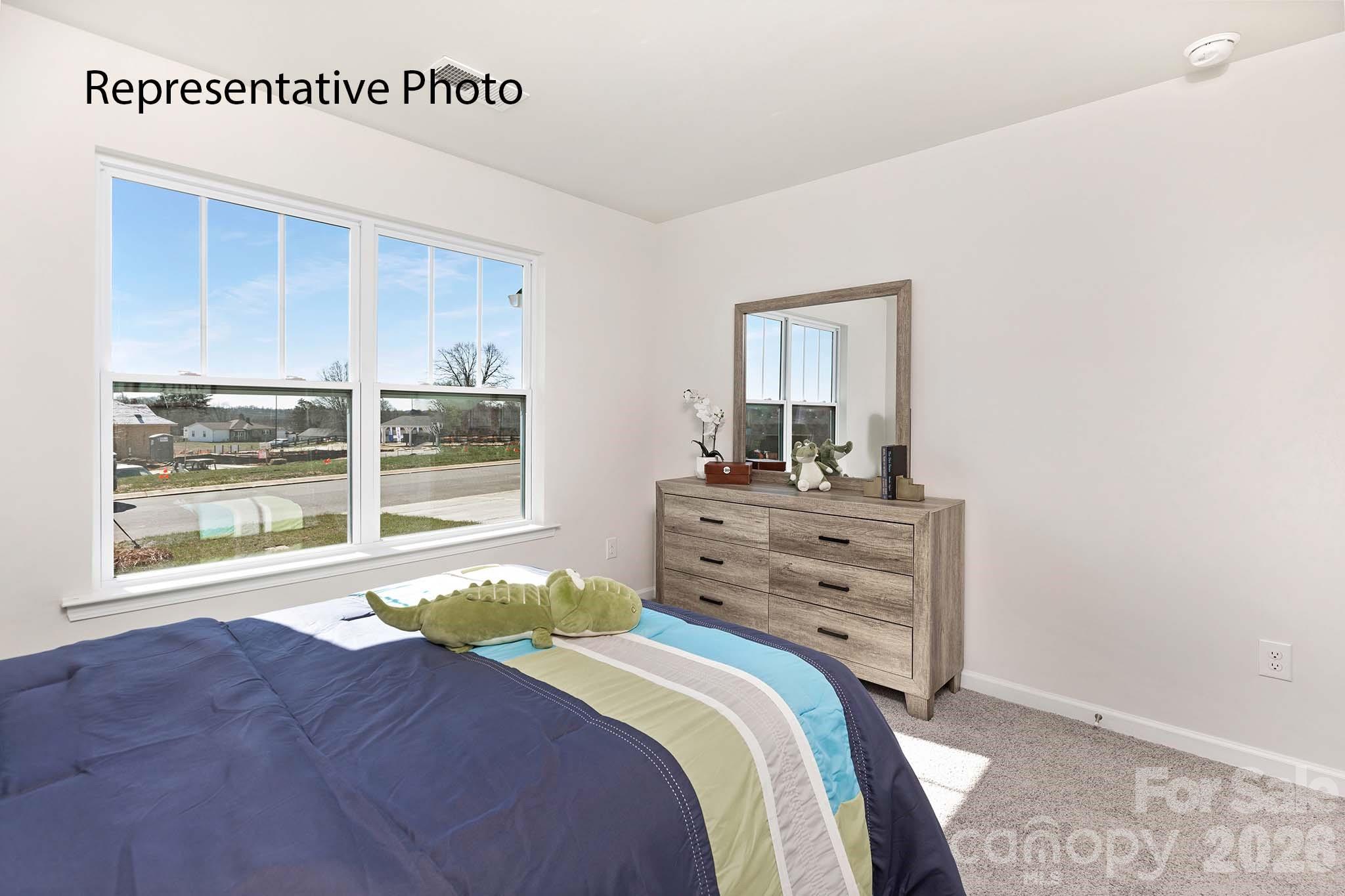 3647 Charles Street Northwest Conover, NC 28613 - Photo 12 of 21 a bedroom with a bed and a window