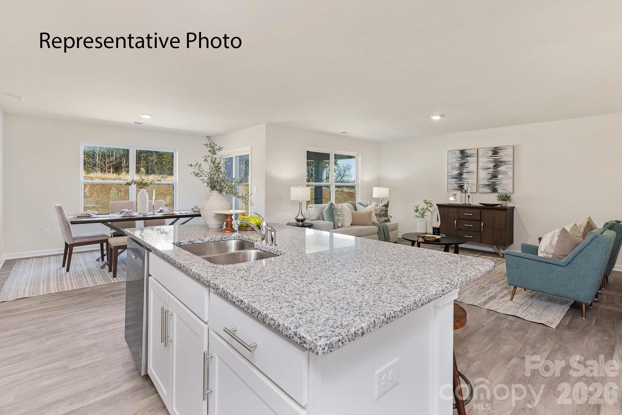 3647 Charles Street Northwest Conover, NC 28613 - Photo 15 of 21 a living room with furniture and a wooden floor