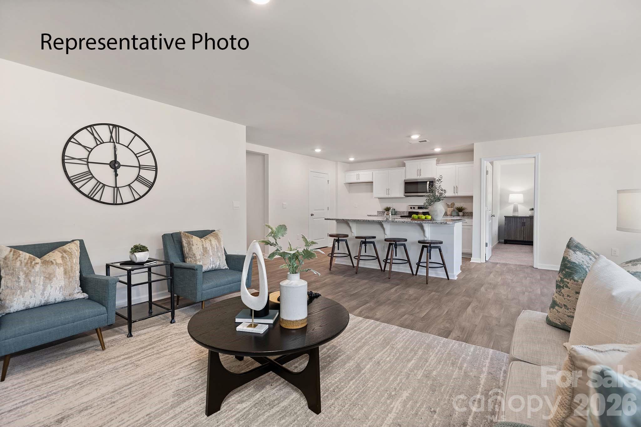 3647 Charles Street Northwest Conover, NC 28613 - Photo 5 of 21 a living room with furniture and kitchen view