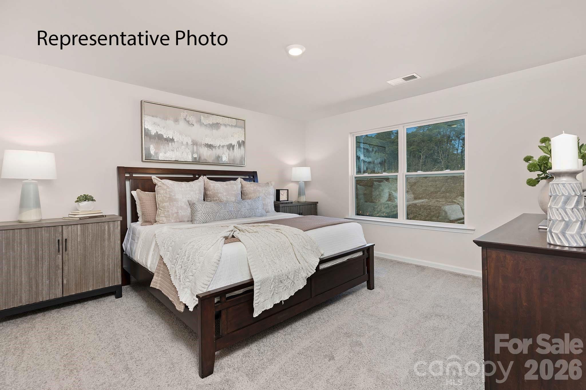3647 Charles Street Northwest Conover, NC 28613 - Photo 7 of 21 a bedroom with a bed and window