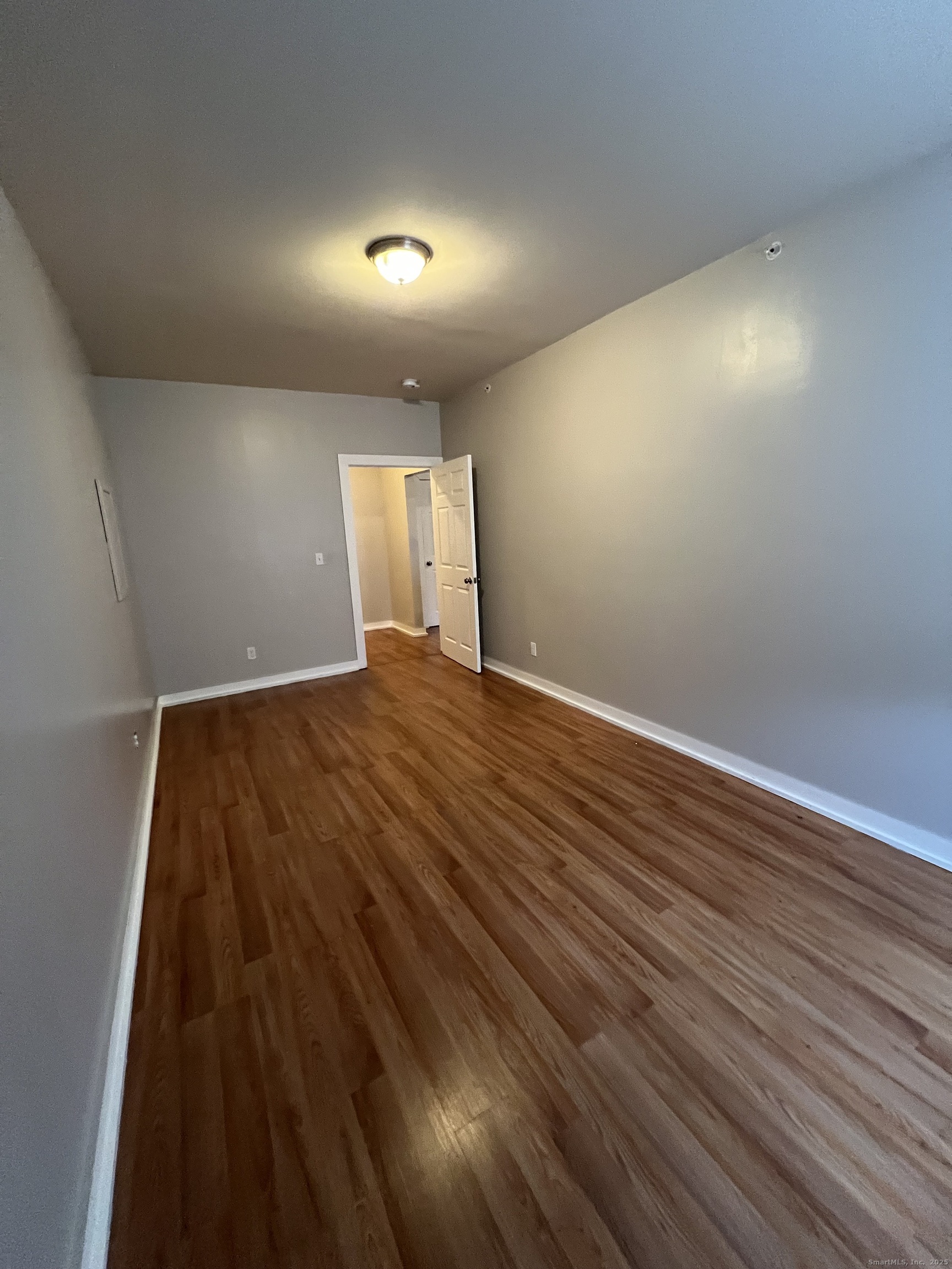 385 Putnam Avenue, Unit 18 Hamden, CT 06517 - Photo 13 of 14 a view of a room with wooden floor