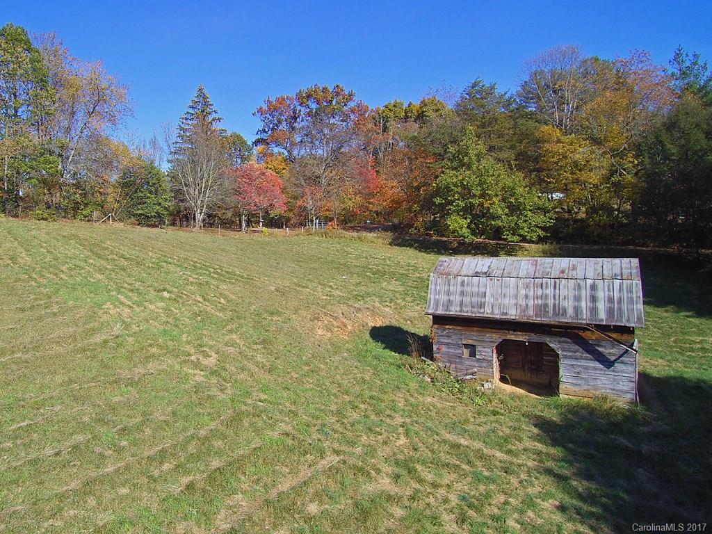 a view of balcony with wooden floor and outdoor seating
