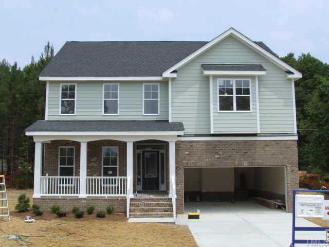 5815 Spring Glen Lane Raleigh, NC 27616 - Photo 1 of 2 a view of a house with a balcony