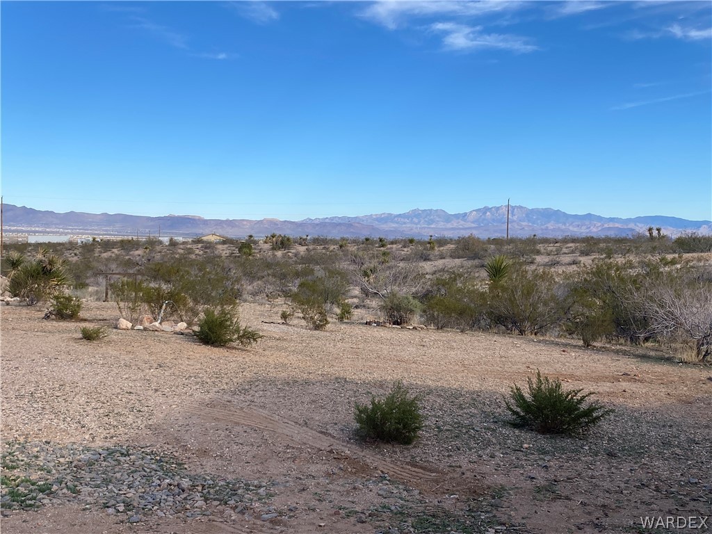 1533 Greer Road Golden Valley, AZ 86413 - Photo 54 of 56 a view of a road with a mountain in the background